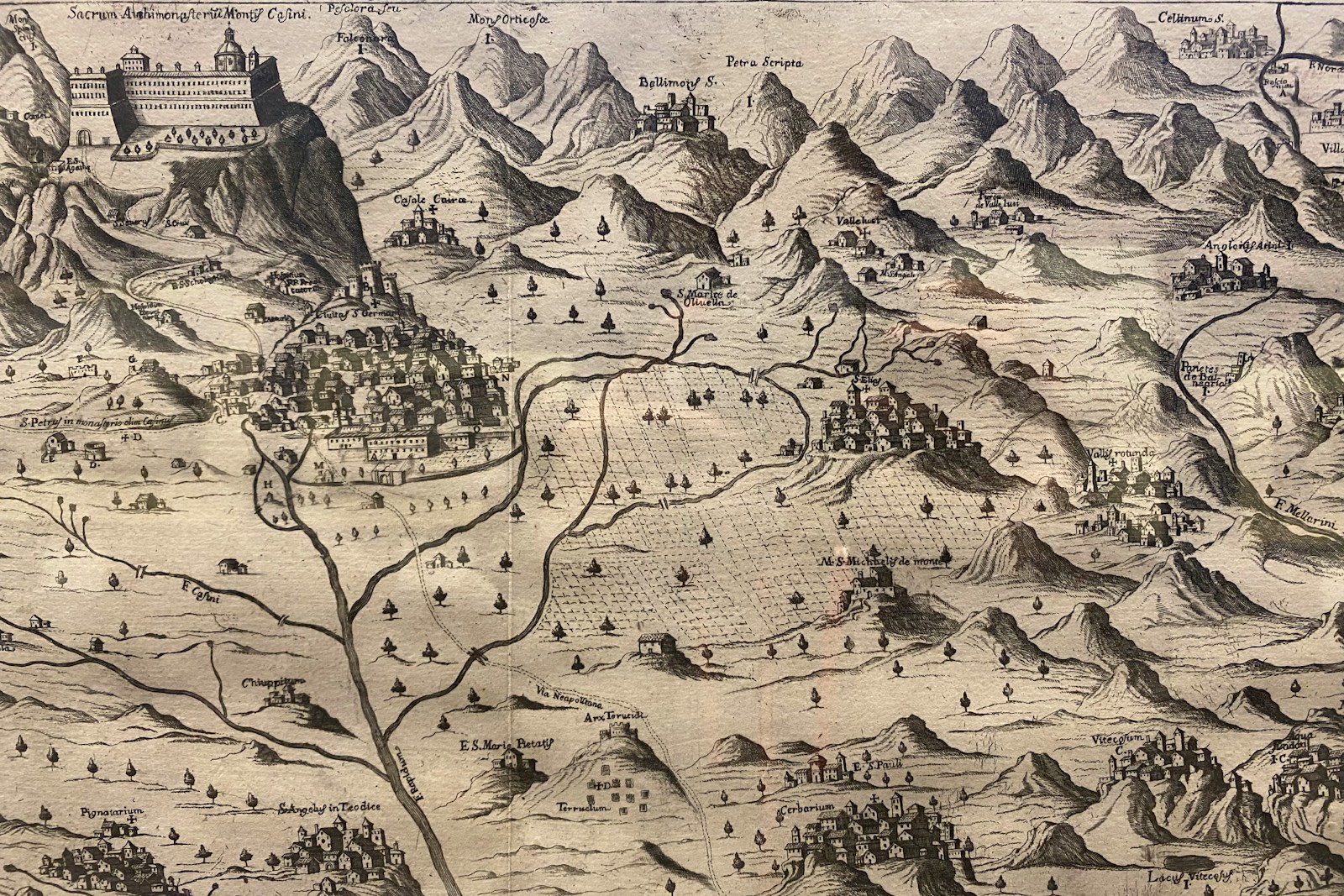 Antique map of a mountainous landscape with a river.